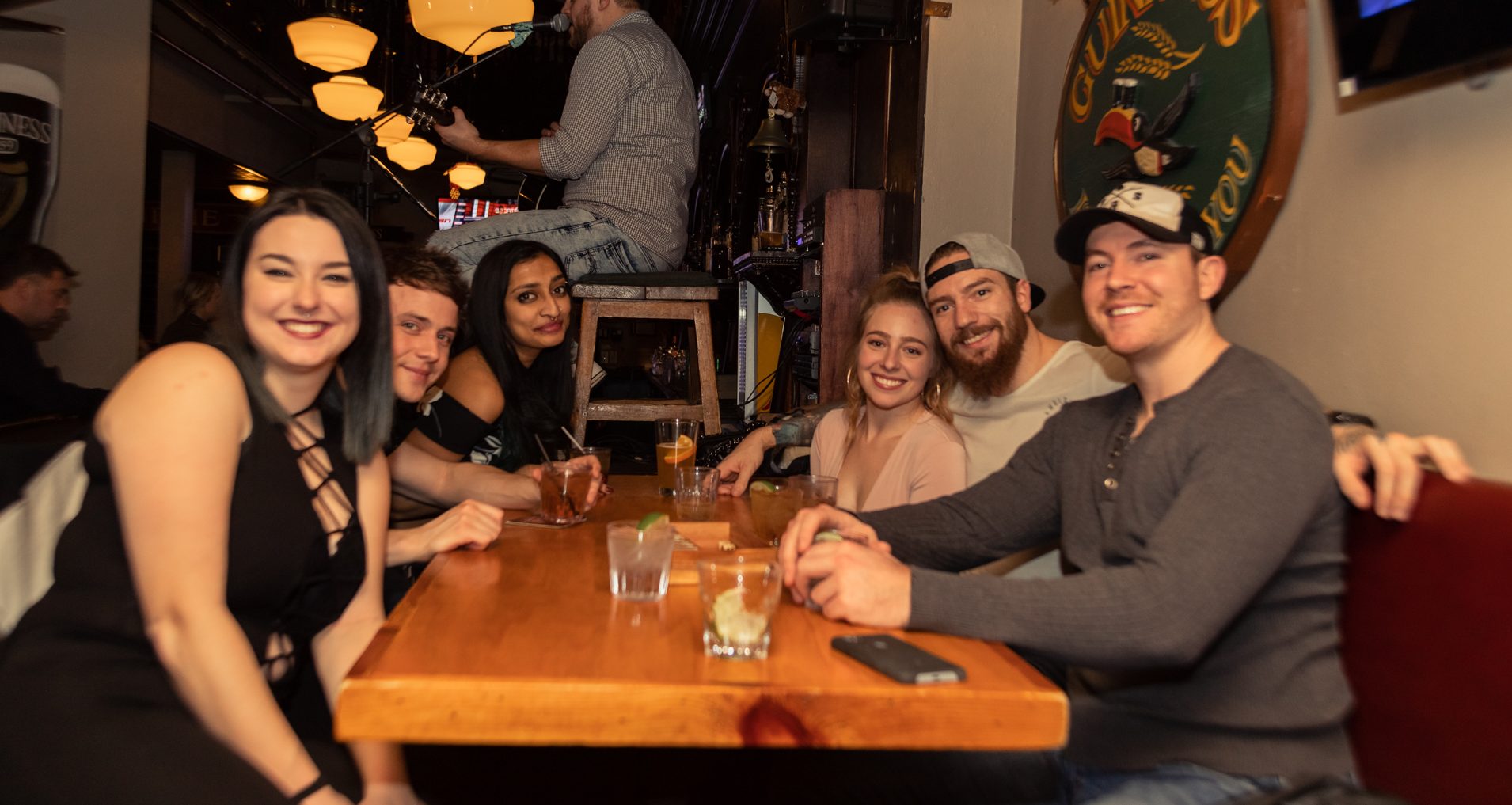 Group Of Friends Enjoying Food And Drinks At An Ottawa Irish Pub